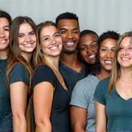 Photo of a smiling, professional cleaning team